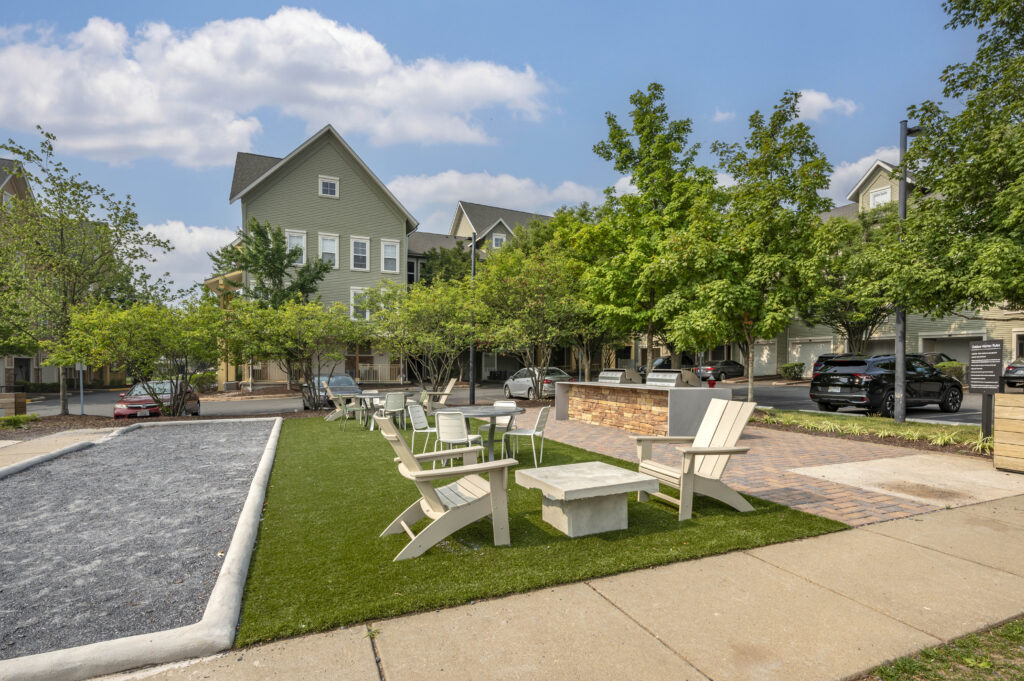 exterior picnic area with seating and game area