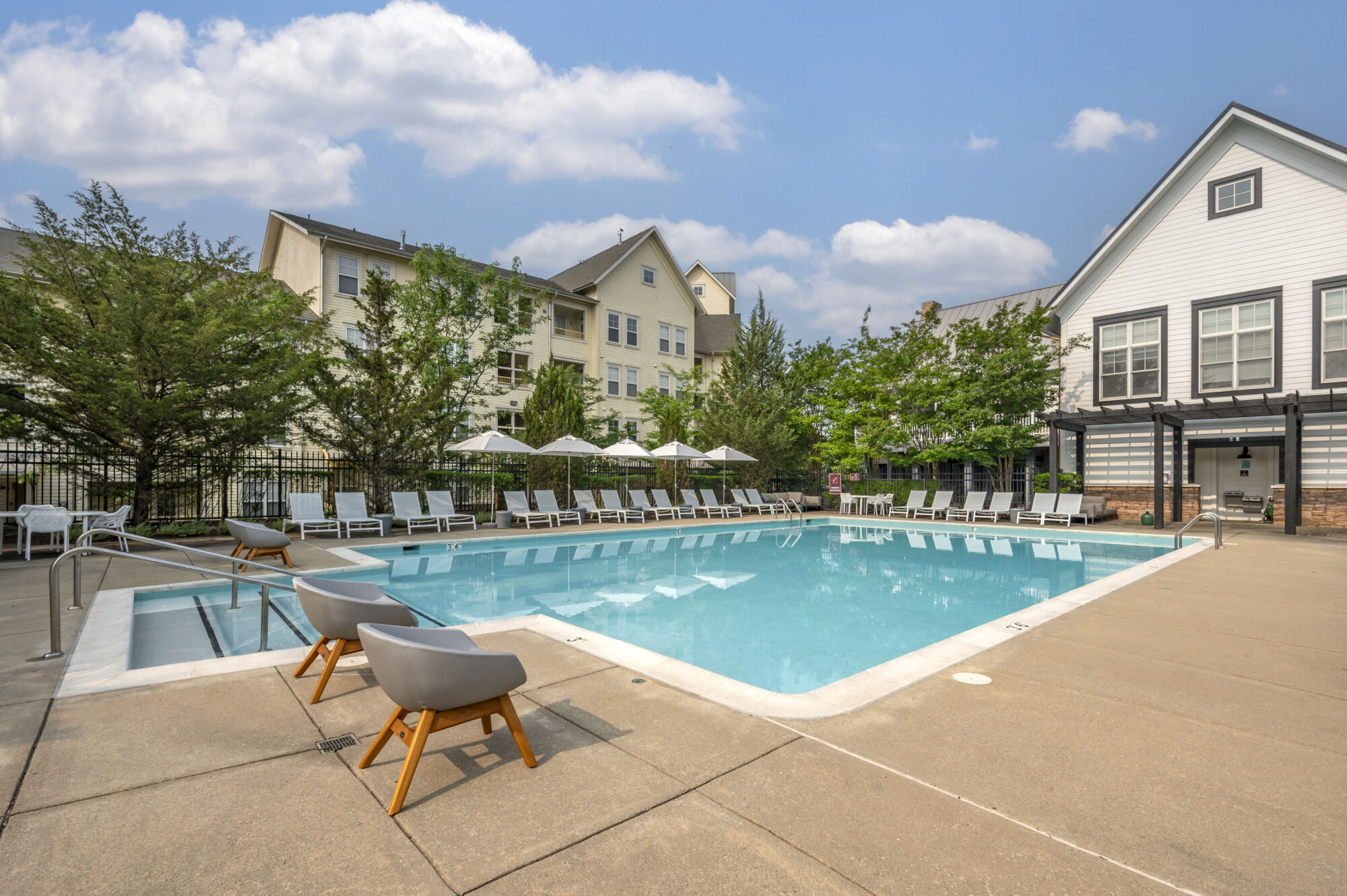 exterior pool with poolside lounge chairs